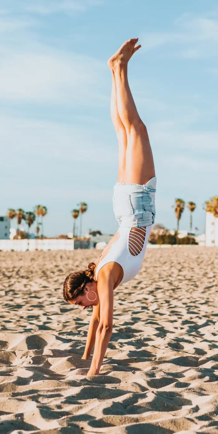 girl upside down on the beach